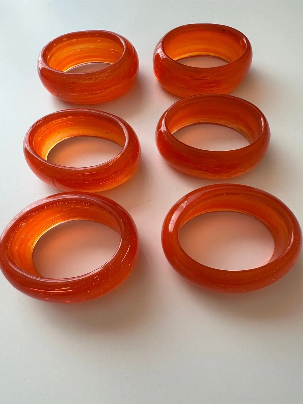 Set of 7 Glass Oval Orange Napkin Rings